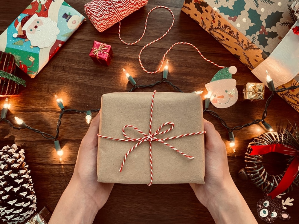 Best Free Christmas Design Assets for Designers: Person Holding Brown Gift Box